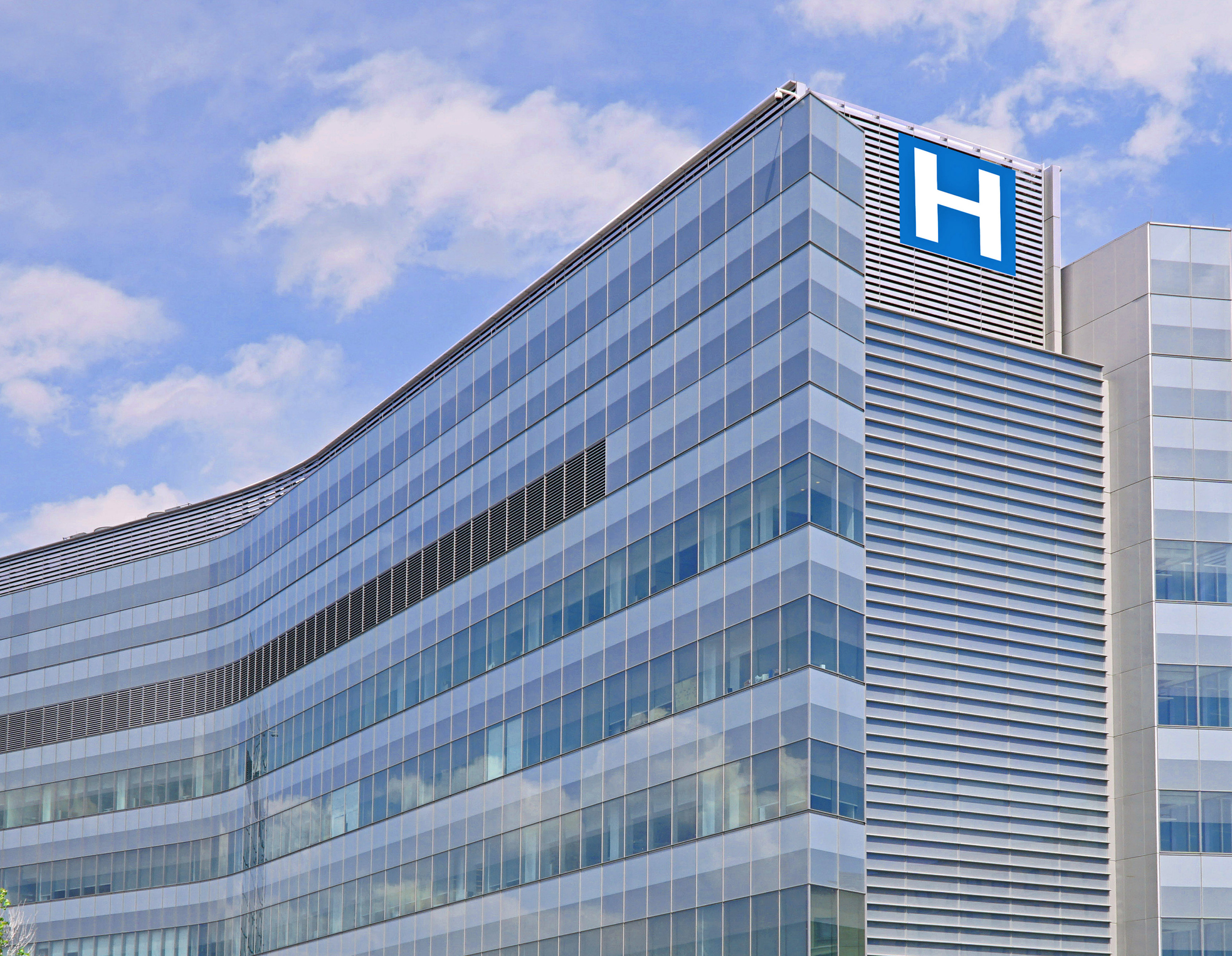 Building with large H sign for hospital XINSURANCE